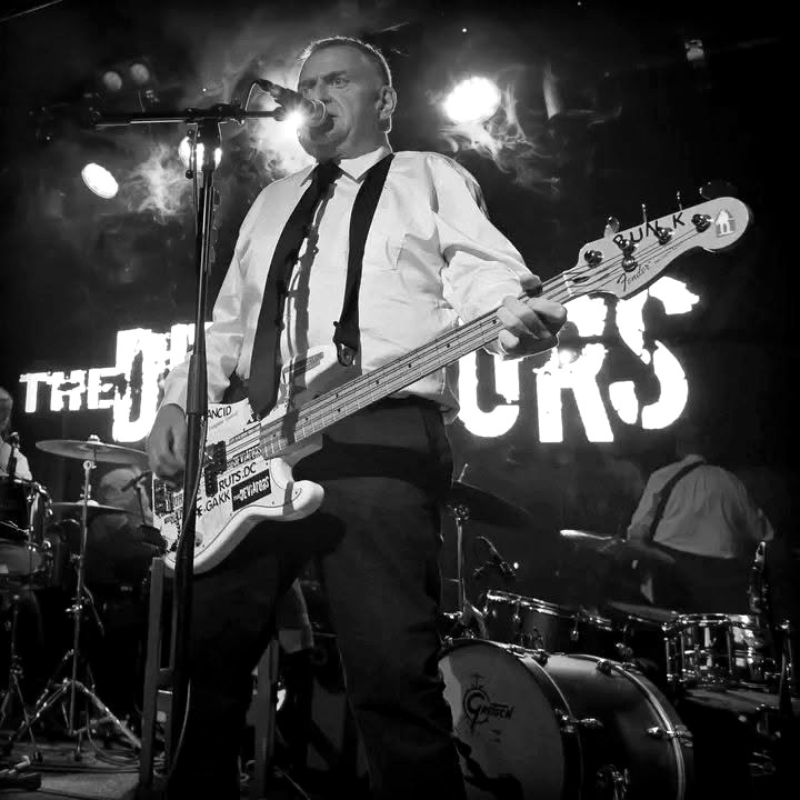 Bren performing on bass and vocals