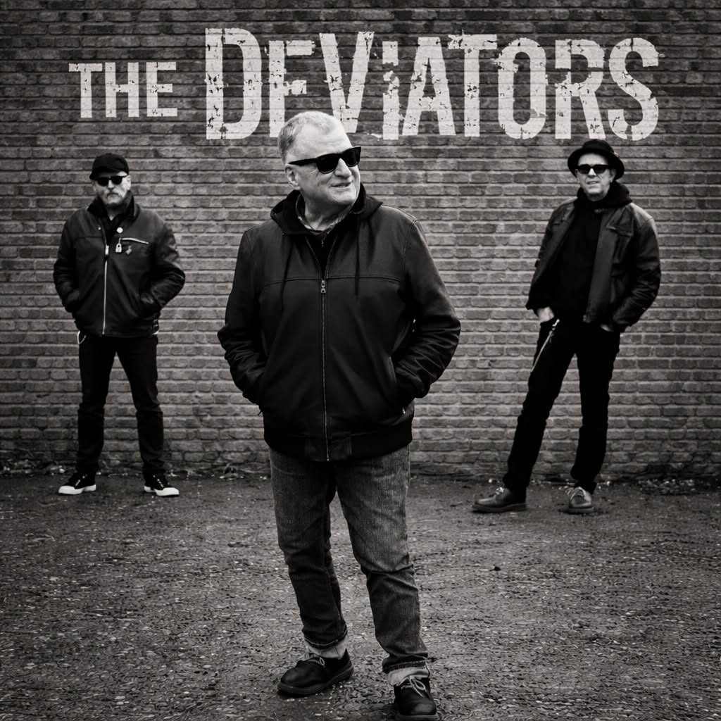 The Deviators standing in front of their painted band logo